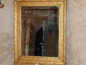 Restauro di una cornice e doratura a foglia.